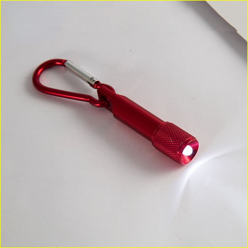 Comercio al por mayor LED resplandor pequeño llavero de aleación de zinc linterna